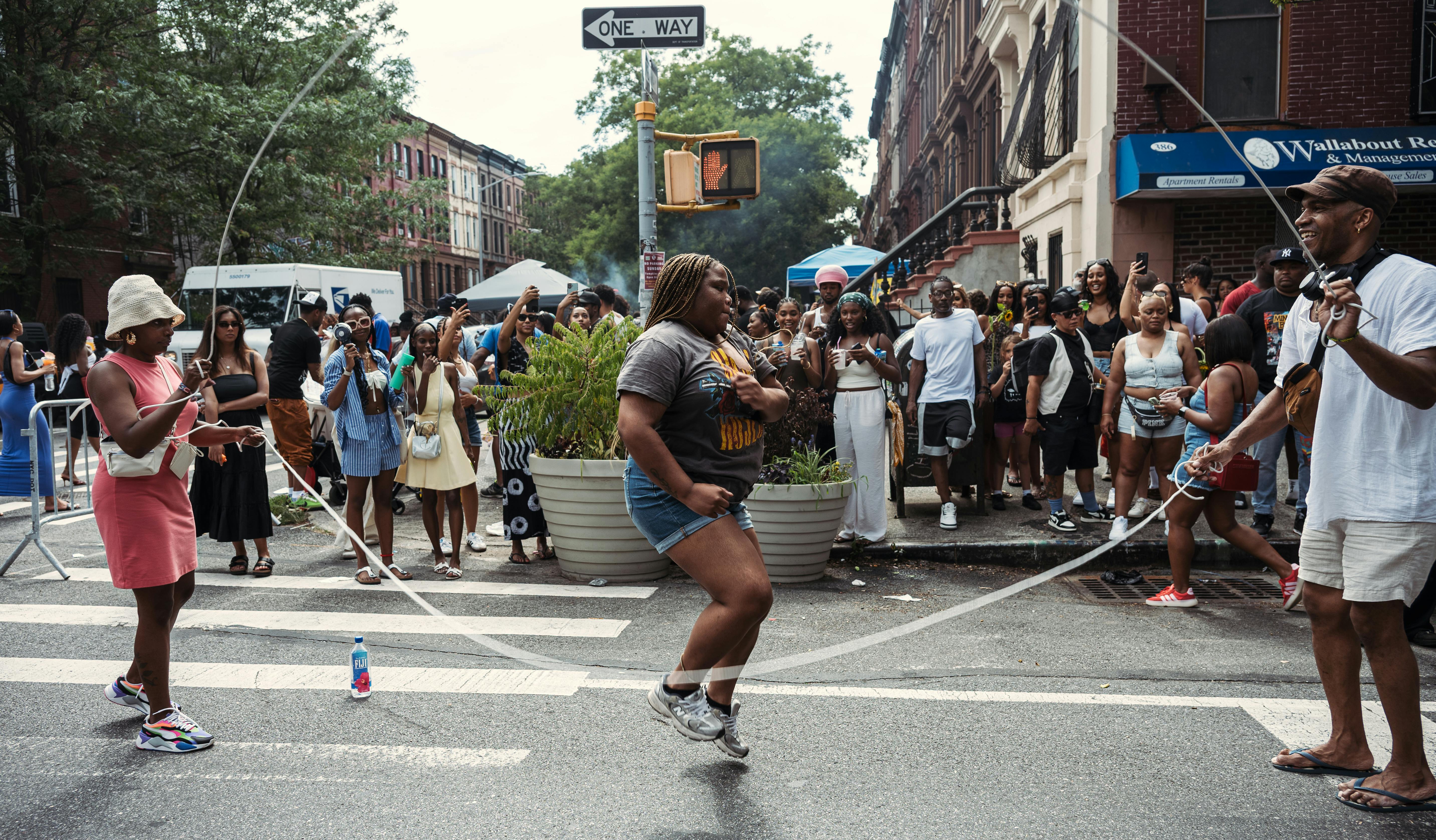 Brooklyn neighborhood community gathering in the street.